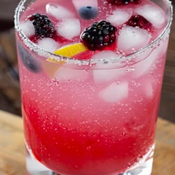 Refreshing lemonade with a splash of sparkling water and mixed berries.