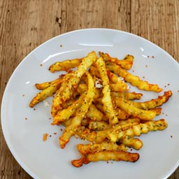 Crispy shoestring fries tossed with truffle oil and grated Parmesan cheese.